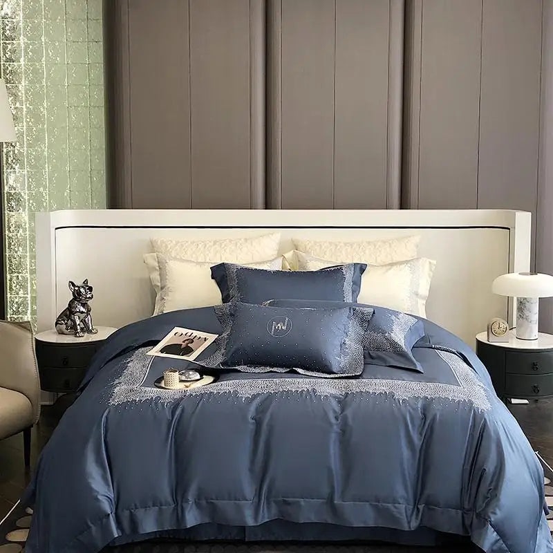 Bedroom with a bed featuring blue bedding and pillows