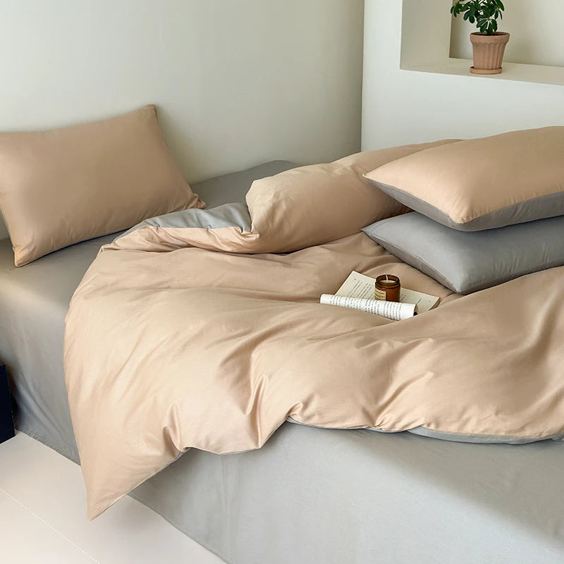Beige bedding set on a bed with a minimalistic background