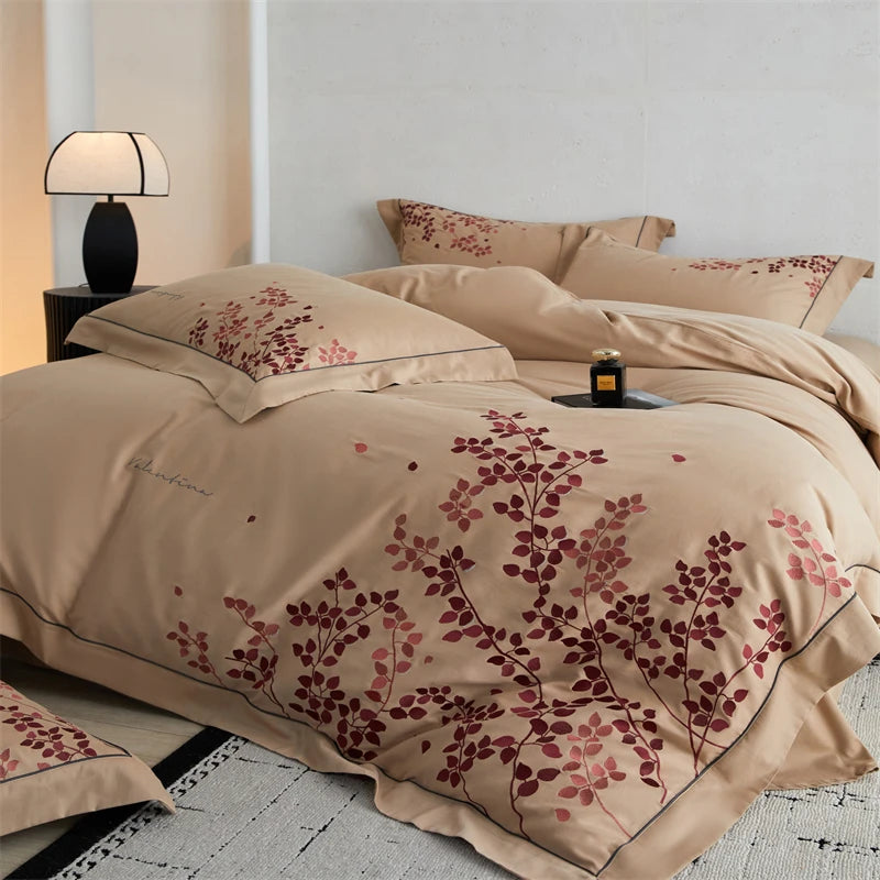 Beige bedding set with floral patterns on a bed 
