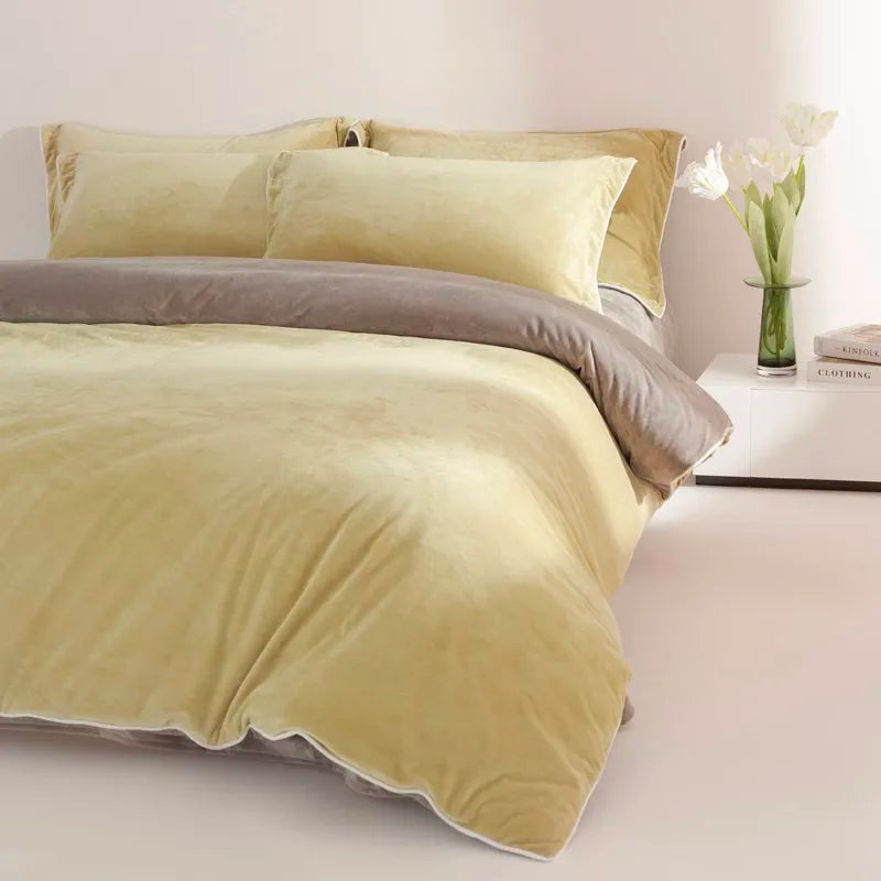 Beige bedding set with gray accent on a bed in a bedroom setting.
