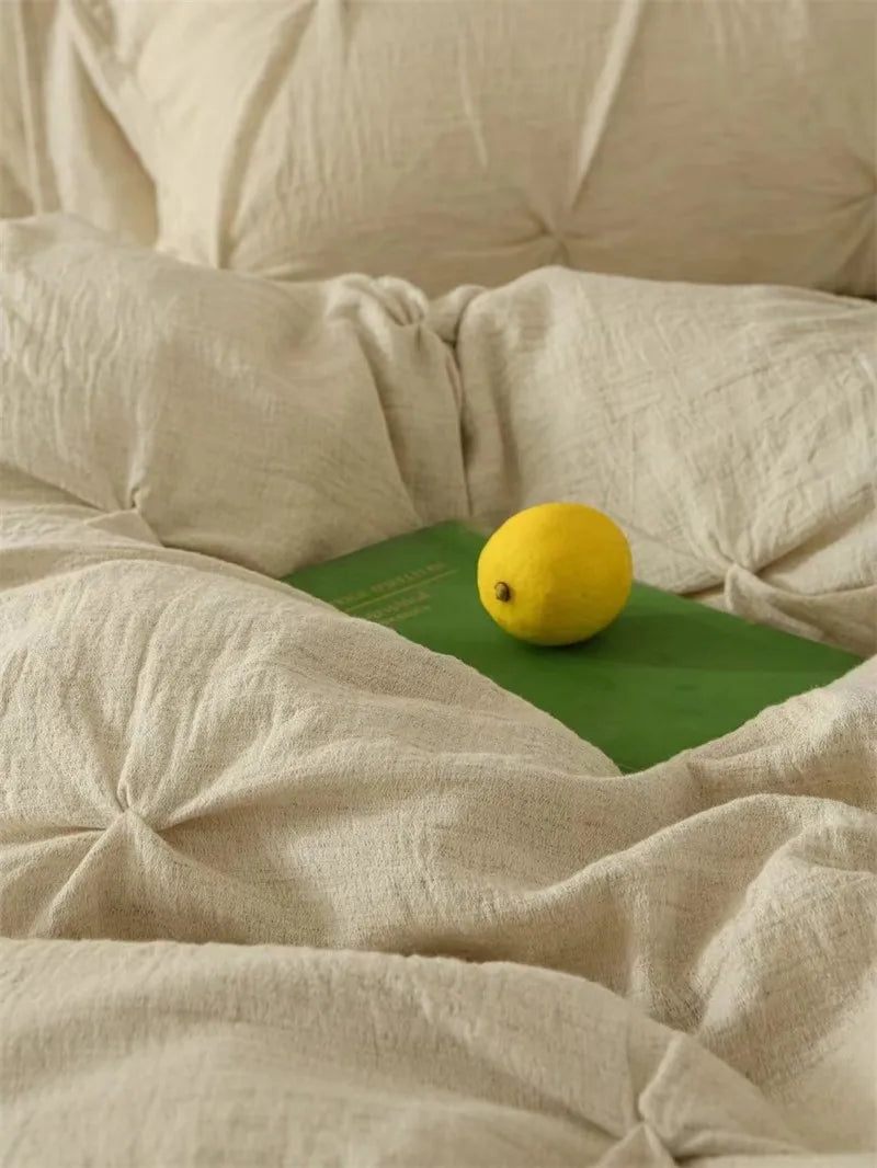 Beige pillows and bedding in the background