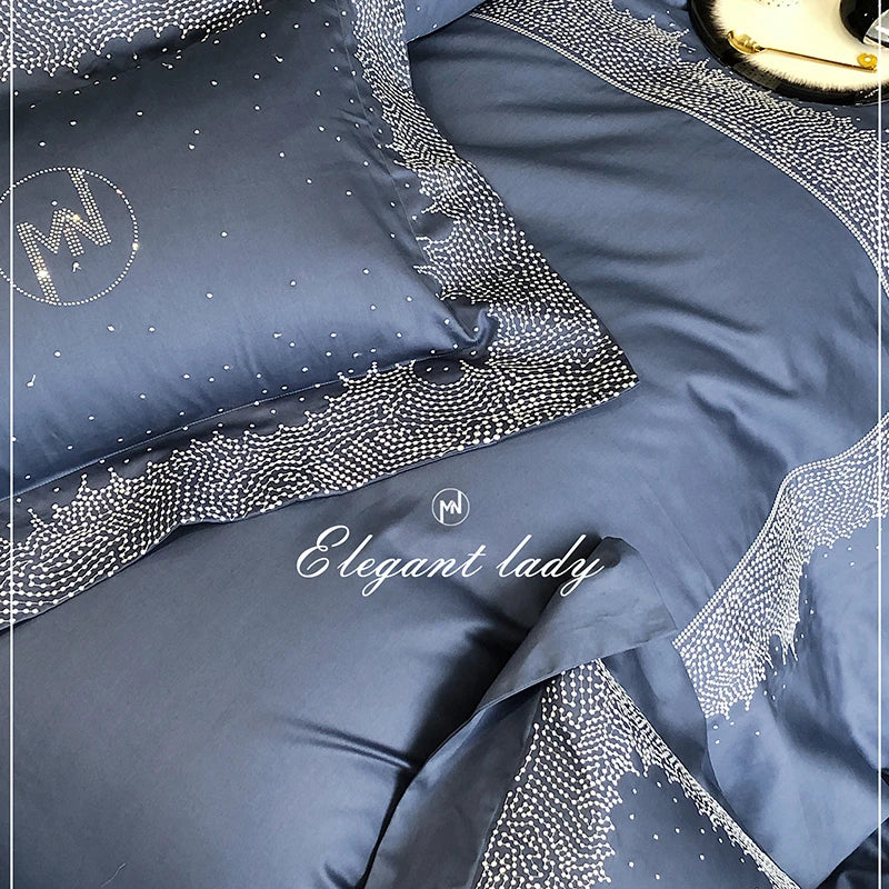 Blue satin bedding set with decorative patterns and 'Elegant Lady' branding.