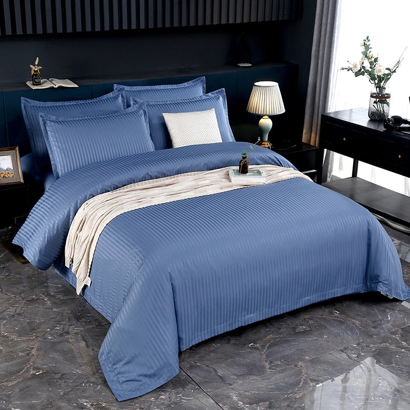 Blue striped bedding set on a bed.