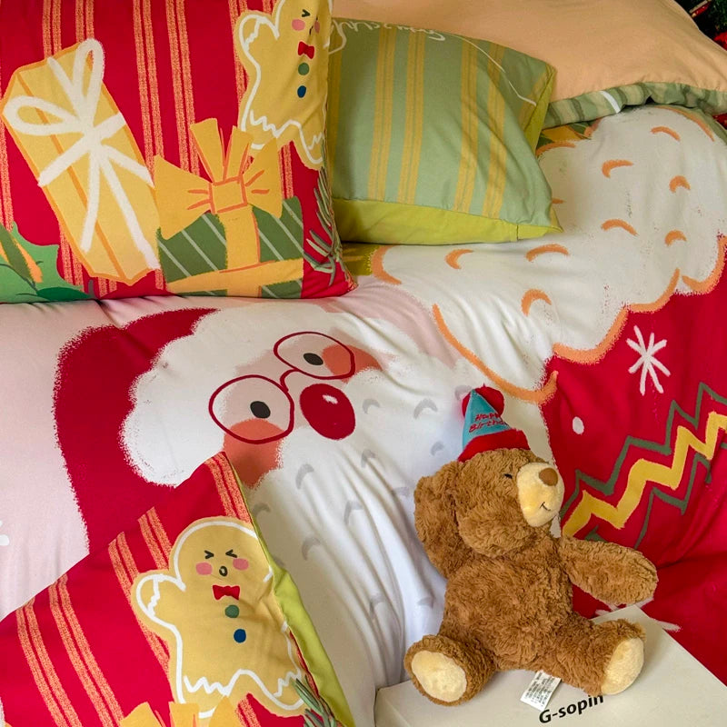 Children's bed with festive bedding featuring gingerbread men, presents, and a teddy bear.