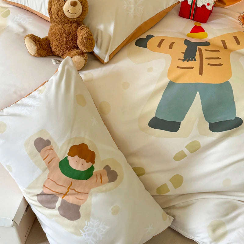 Children's bedding set with cartoon character design on a bed with a teddy bear.