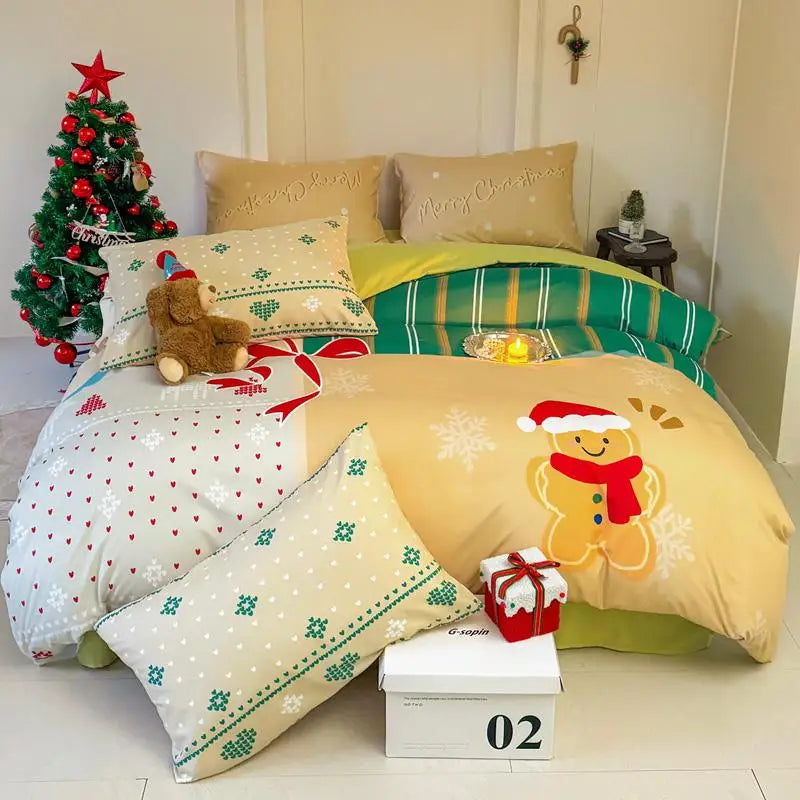 Christmas-themed bedding set with gingerbread man design on a bed in a room with a small Christmas tree.