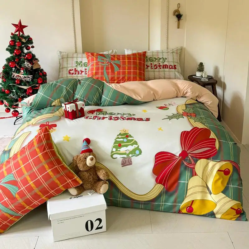 Christmas-themed bedspread with festive decorations in a bedroom setting.