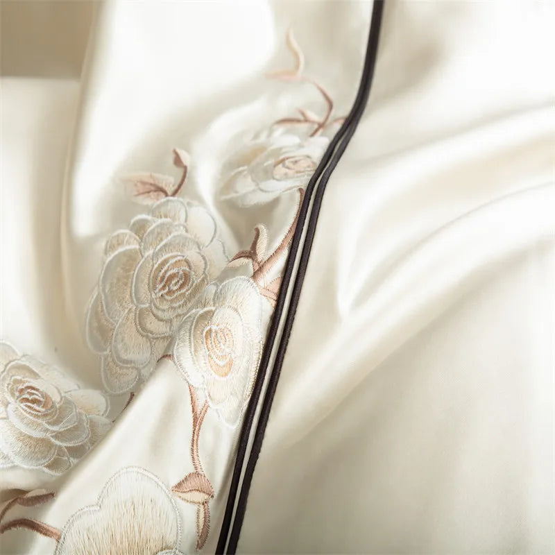 Close-up of a cream-colored fabric with floral embroidery