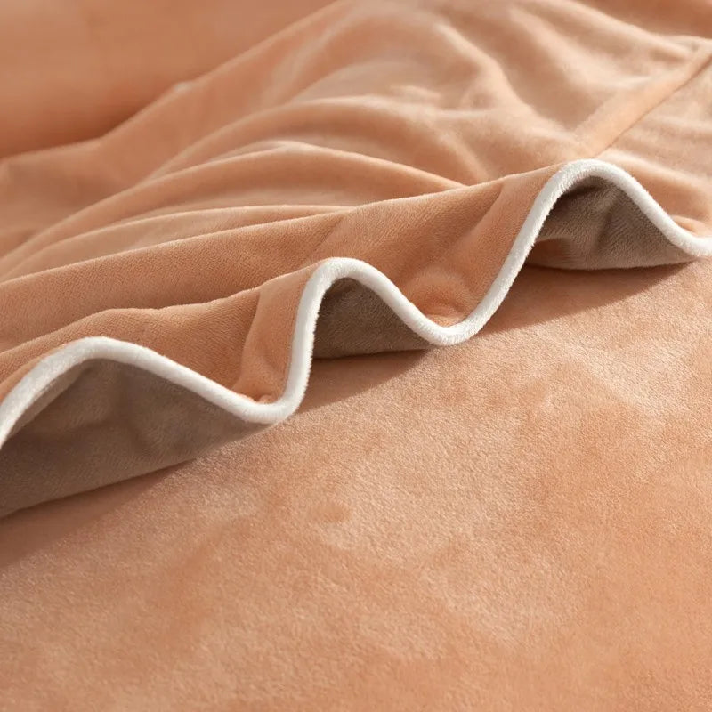 Close-up of a peach duvet cover with white trim