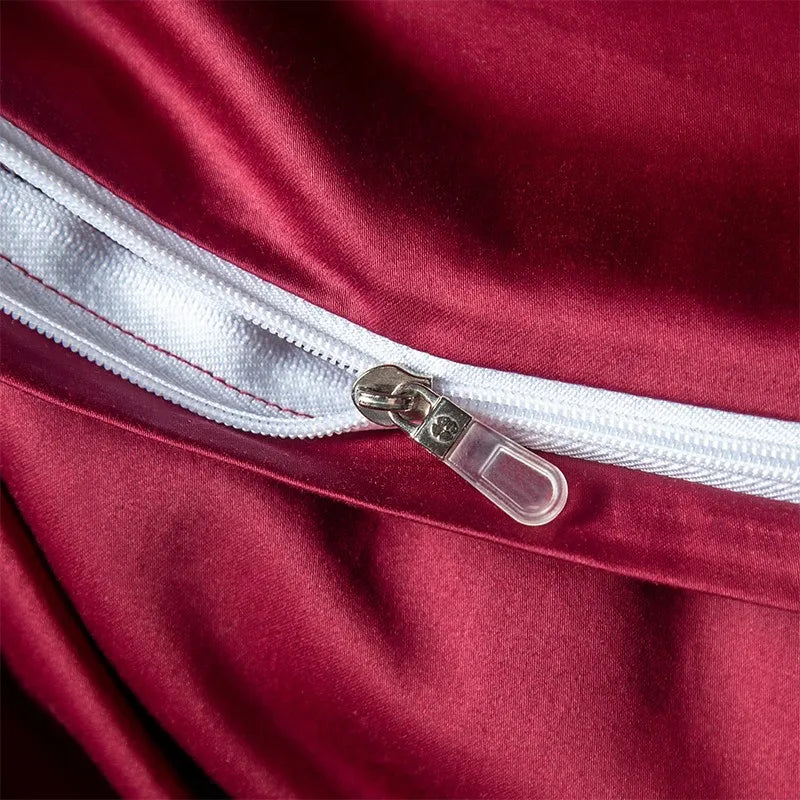 Close-up of a red bedding set sheet with a white zipper