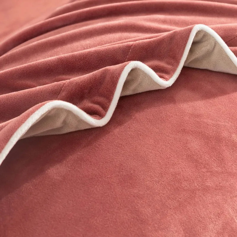 Close-up of a velvet textured rust sheet with white trim 500TC reversible bedding set 