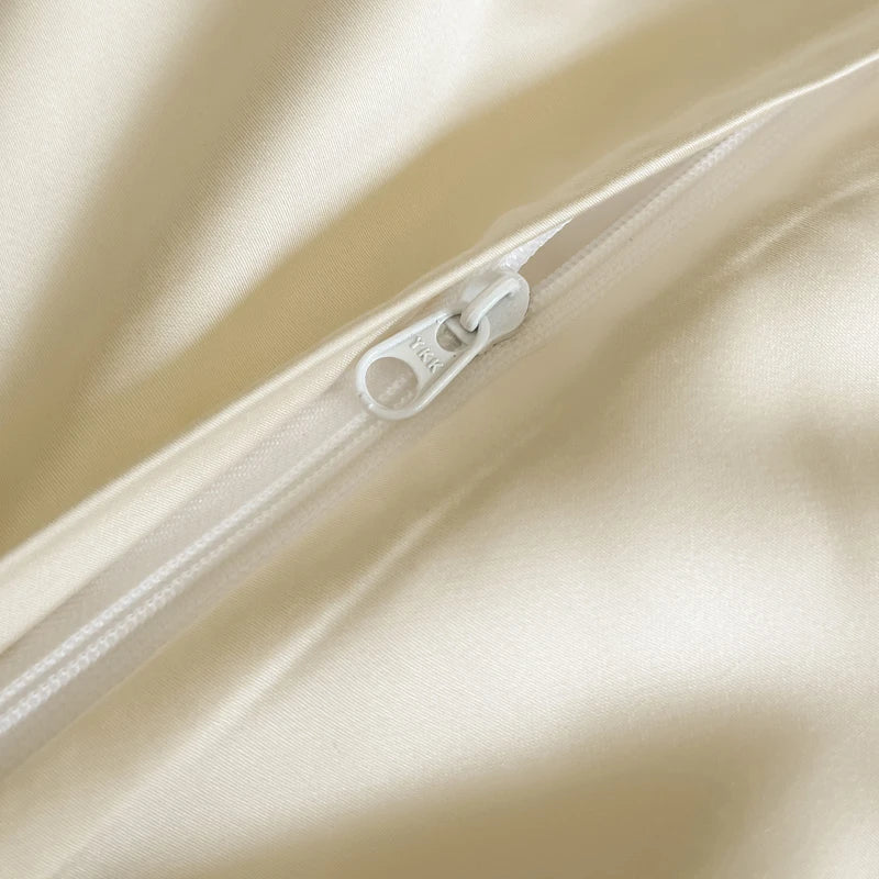Close-up of a zipper on beige fabric