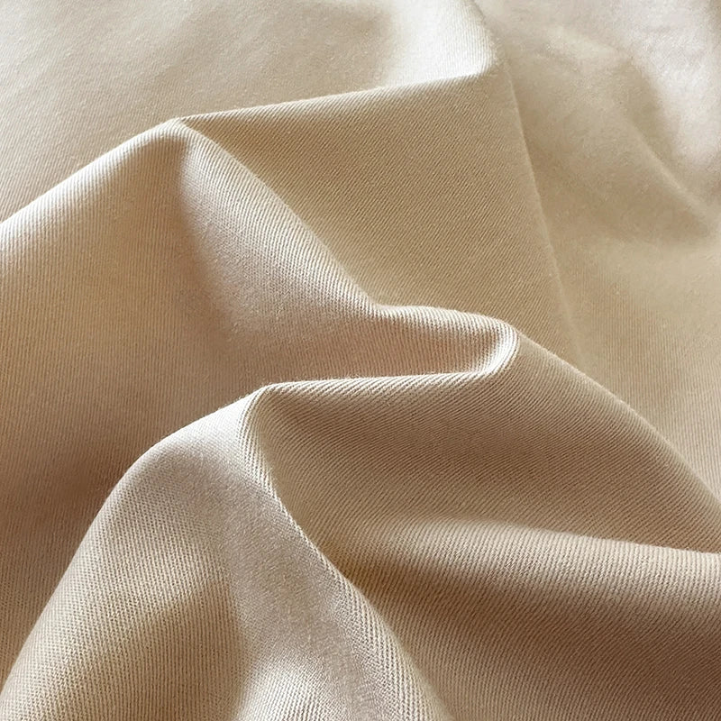 Close-up of beige fabric with folds