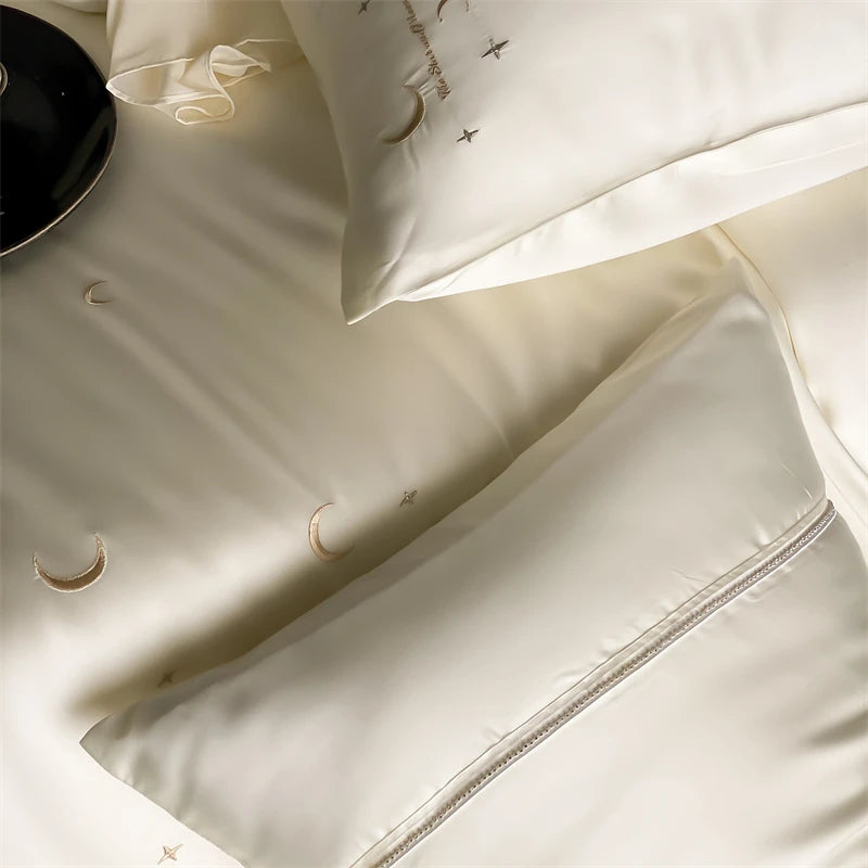 Close-up of beige lyocell pillowcases with subtle patterns on a light background
