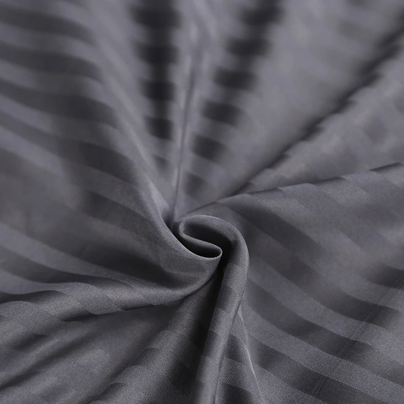 Close-up of gray bedding set with a subtle pattern
