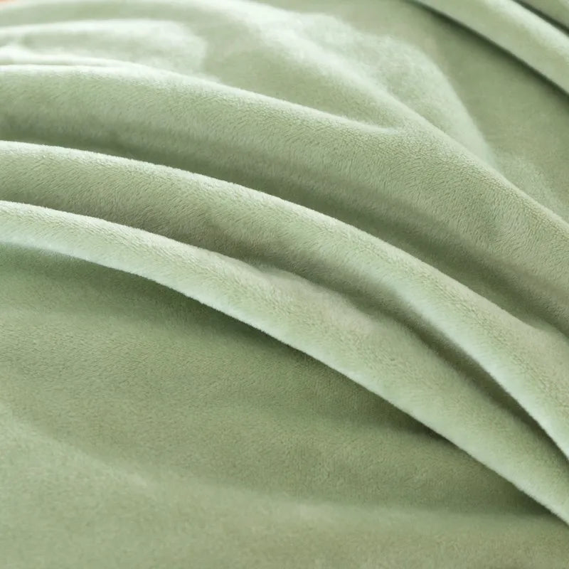 Close-up of green duvet cover fabric with folds