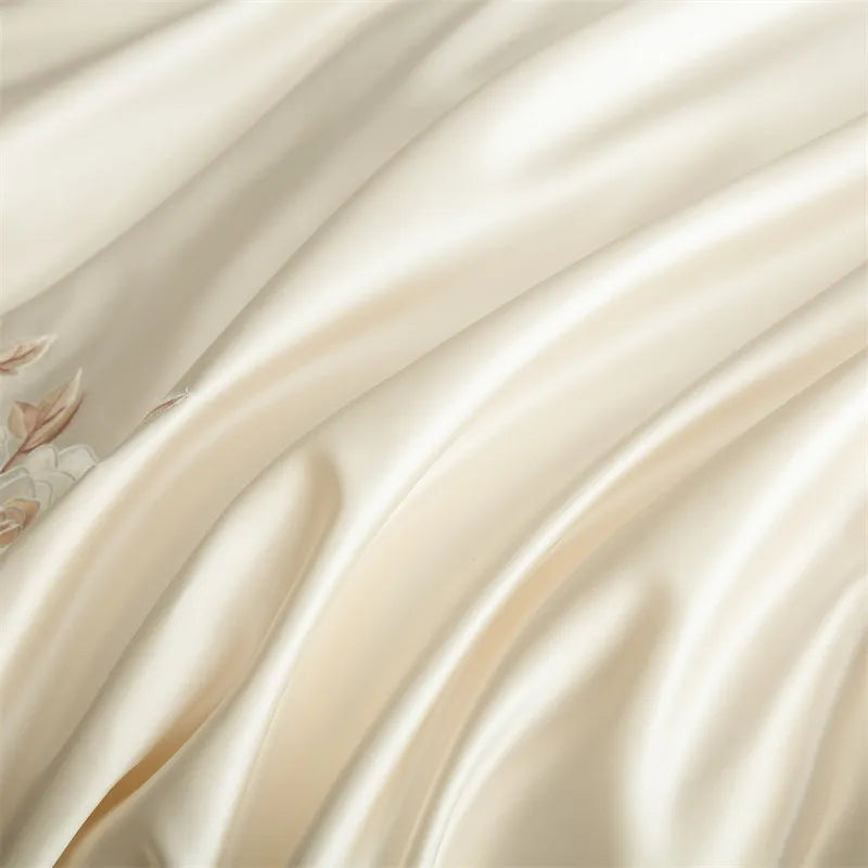 Close-up of smooth, beige fabric with a subtle pattern.