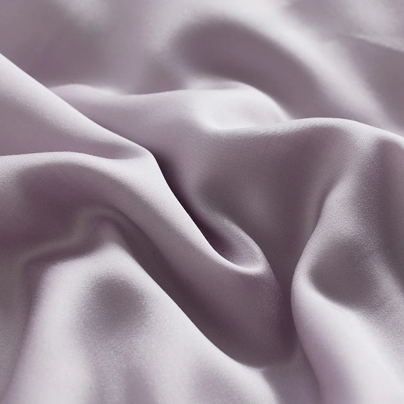 Close-up of soft, light purple fabric with folds