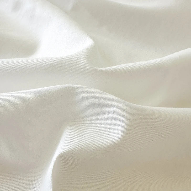 Close-up of white 100% cotton fabric with visible texture