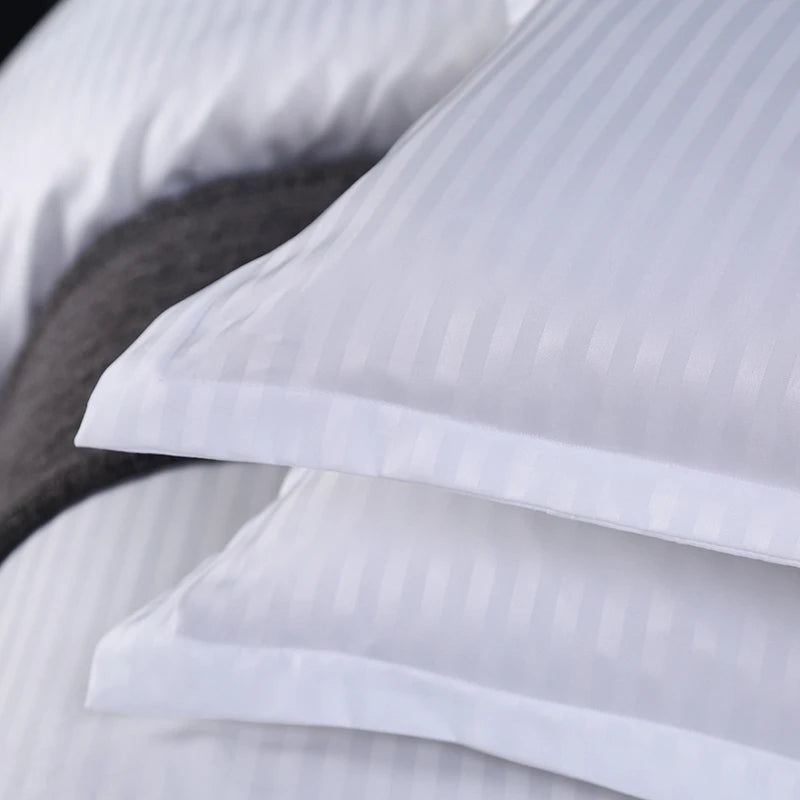 Close-up of white pillowcases and bedding set