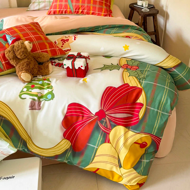Decorative bedspread with Christmas-themed design featuring red bows and yellow bells on duvet cover.