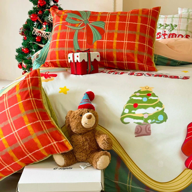 Decorative bedspread with Christmas-themed pillows and a teddy bear bedding set.