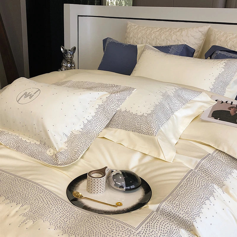 Decorative bedspread with rhinestone accents on a bed with pillows 