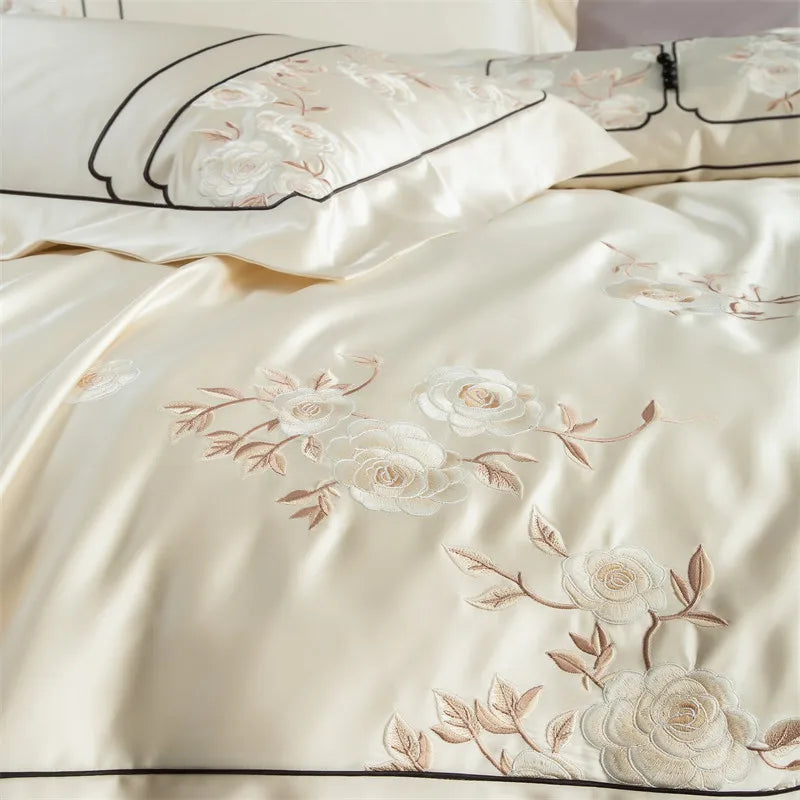 Embroidered floral pattern on beige fabric with black piping bedding set at The Happy Ladies