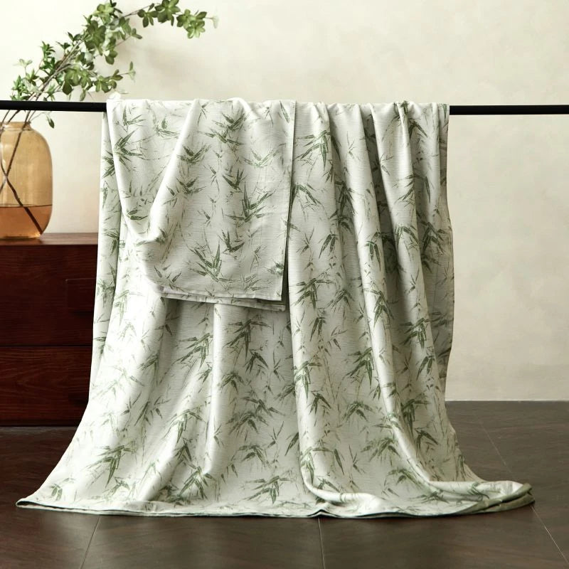 Floral-patterned bed sheet draped over a chair with a neutral background