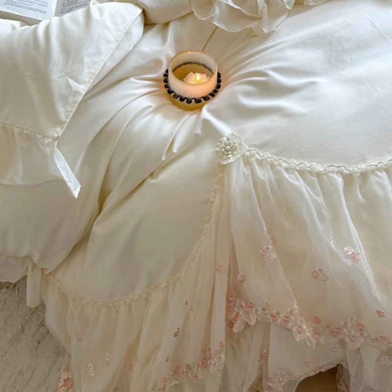 Floral-patterned duvet cover set with a small candle on a textured surface
