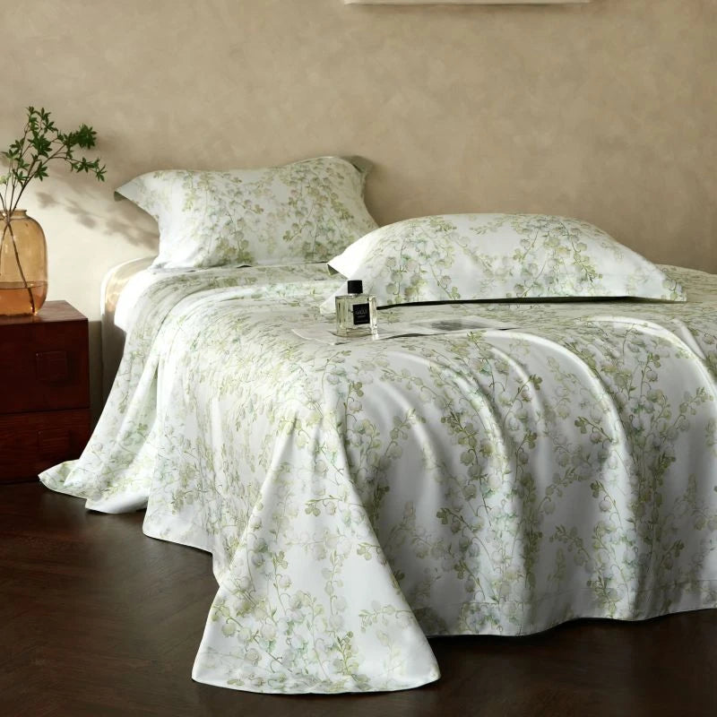 Floral patterned bedspread on a bed in a bedroom setting