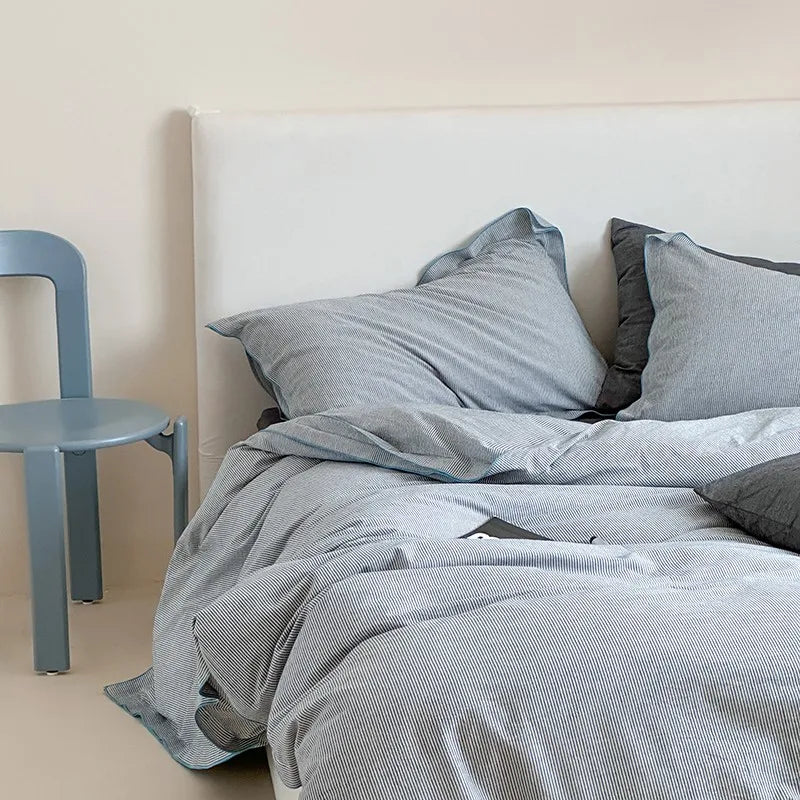 Gray bedding set on a bed cotton bedding