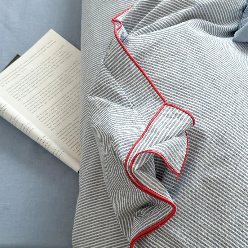 Gray striped duvet cover with red trim