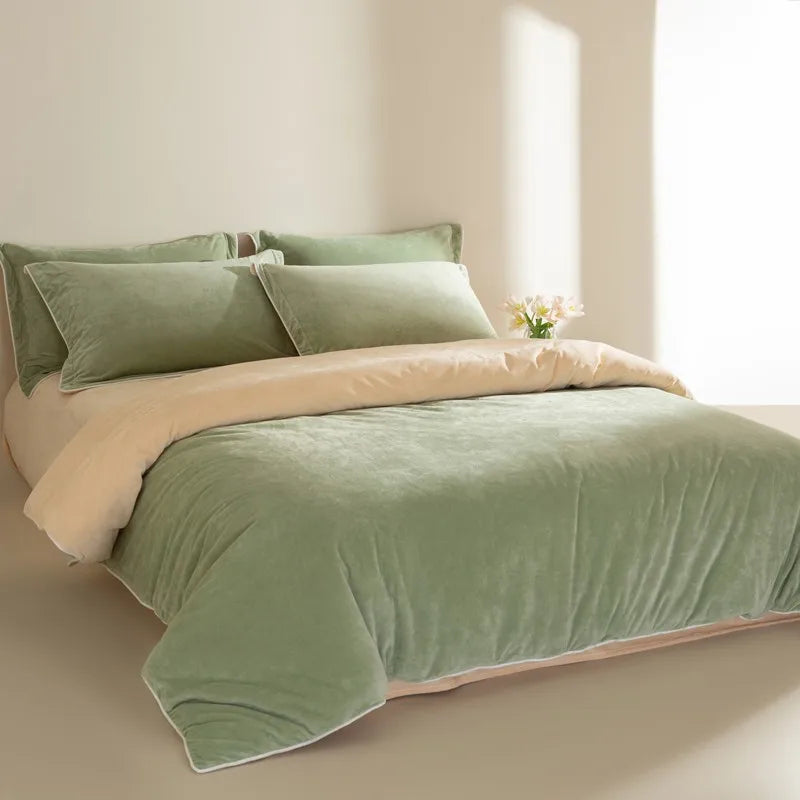 Green and beige bedding set on a bed in a bright room