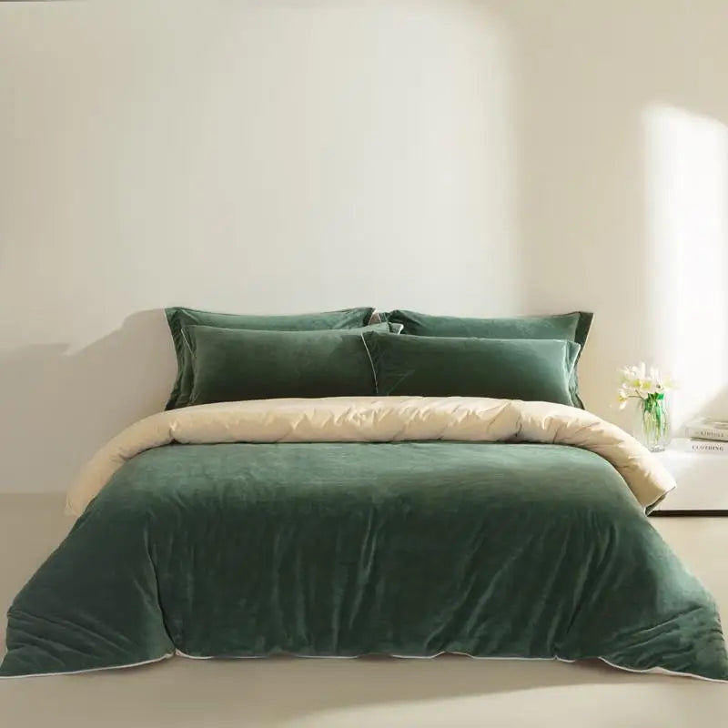 Green velvet bedding set on a bed with a neutral background
