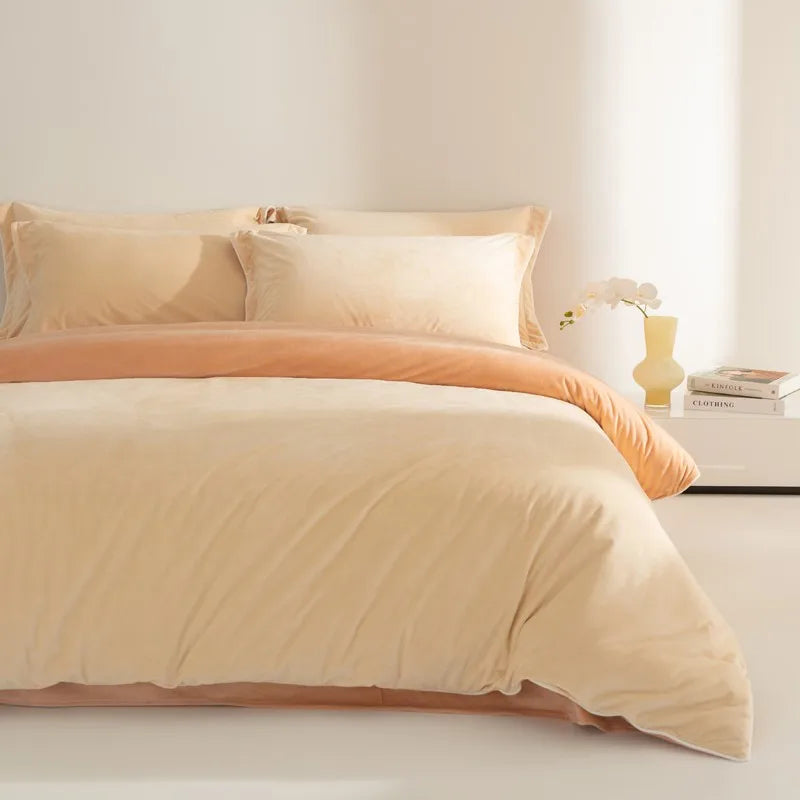 King size 500TC velvet texture Beige and orange bedding set on a bed with a side table in the background.