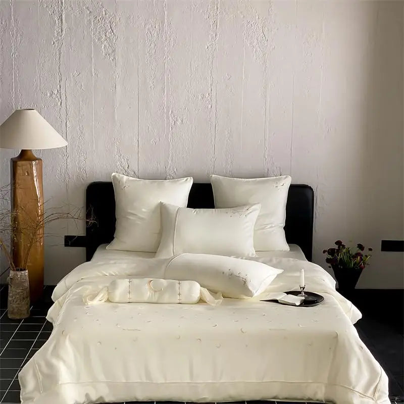 Neatly made bed with white bedding in a bedroom setting.