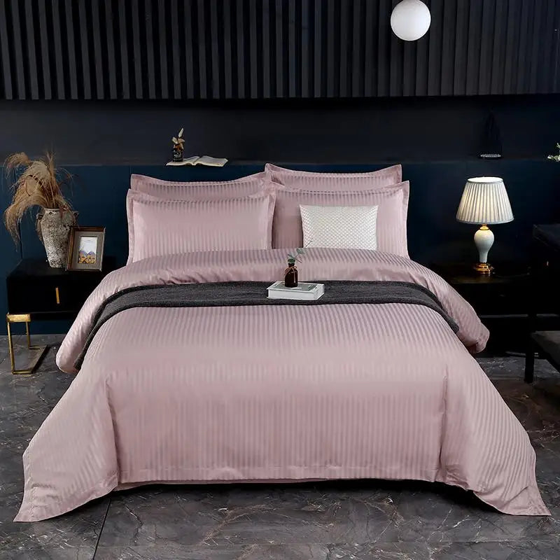 Pink bedding set on a bed in a modern bedroom with dark walls and decor.