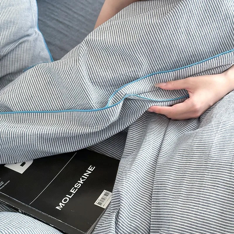 Striped gray duvet cover bedding set with blue trim