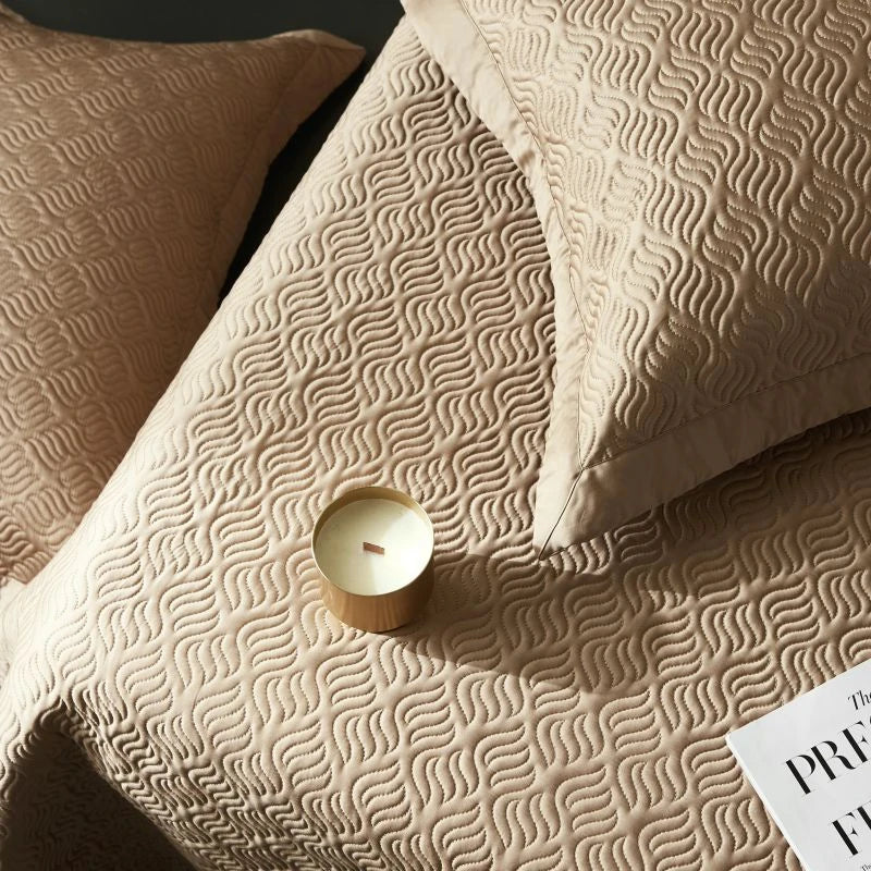 Textured beige bed spread at The Happy Ladies