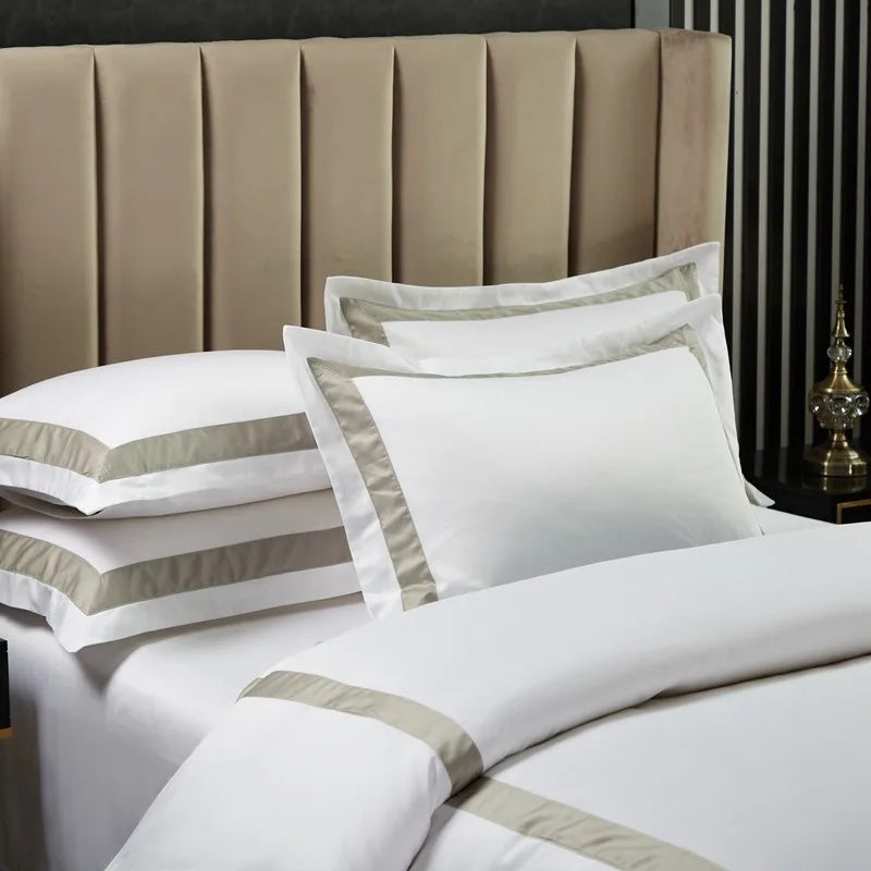 White bedding and striped pillows duvet cover set.