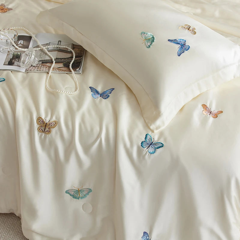 White pillowcase with embroidered butterflies on a light background