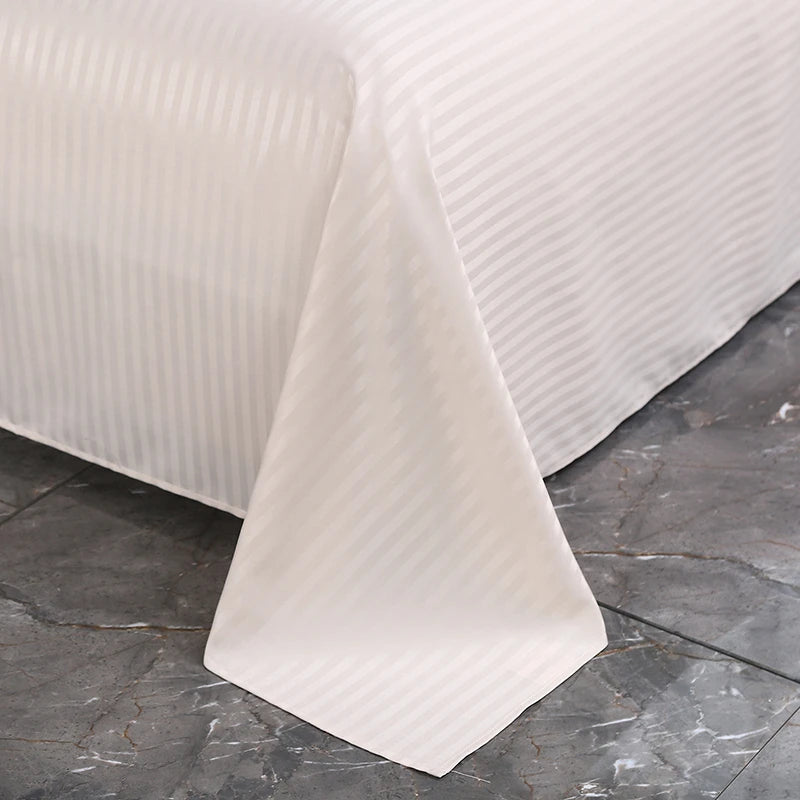 White textured flat bed set on a dark stone surface